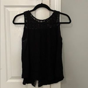 Francesca’s black blouse